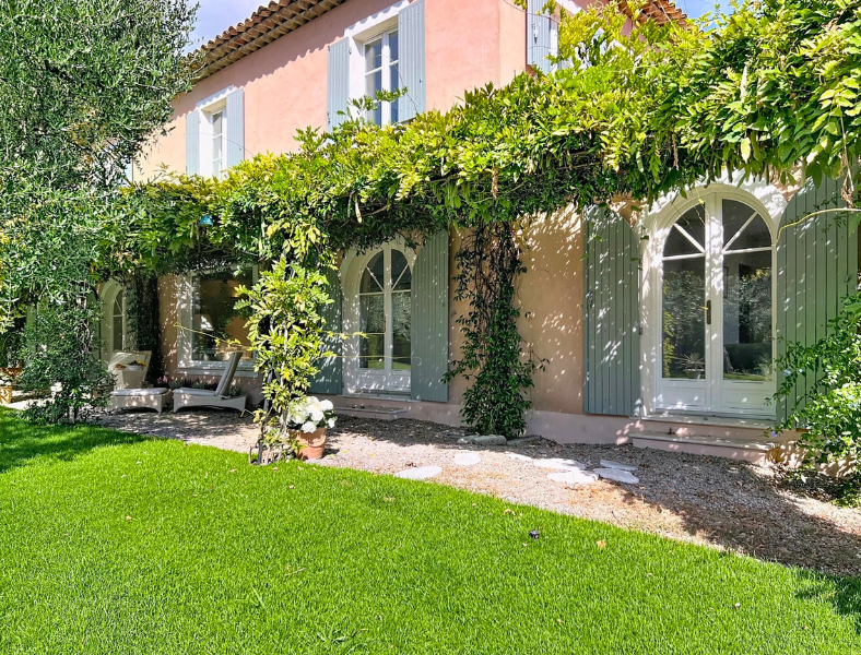 Picturesque villa framed by lush garden