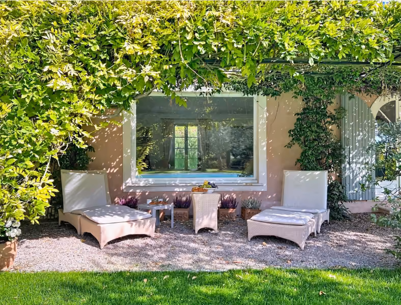 Picturesque villa framed by lush garden