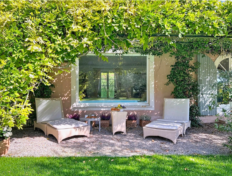 Picturesque villa framed by lush garden