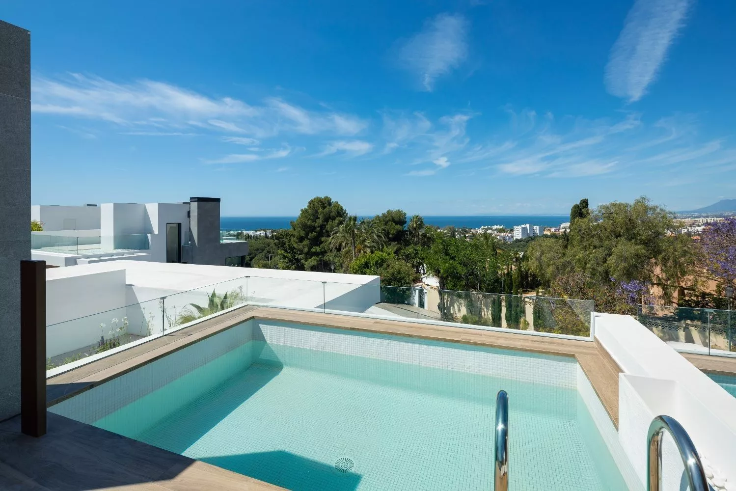 Marbella new-build house with sea views and roof terrace, garden and pool, close to the beach