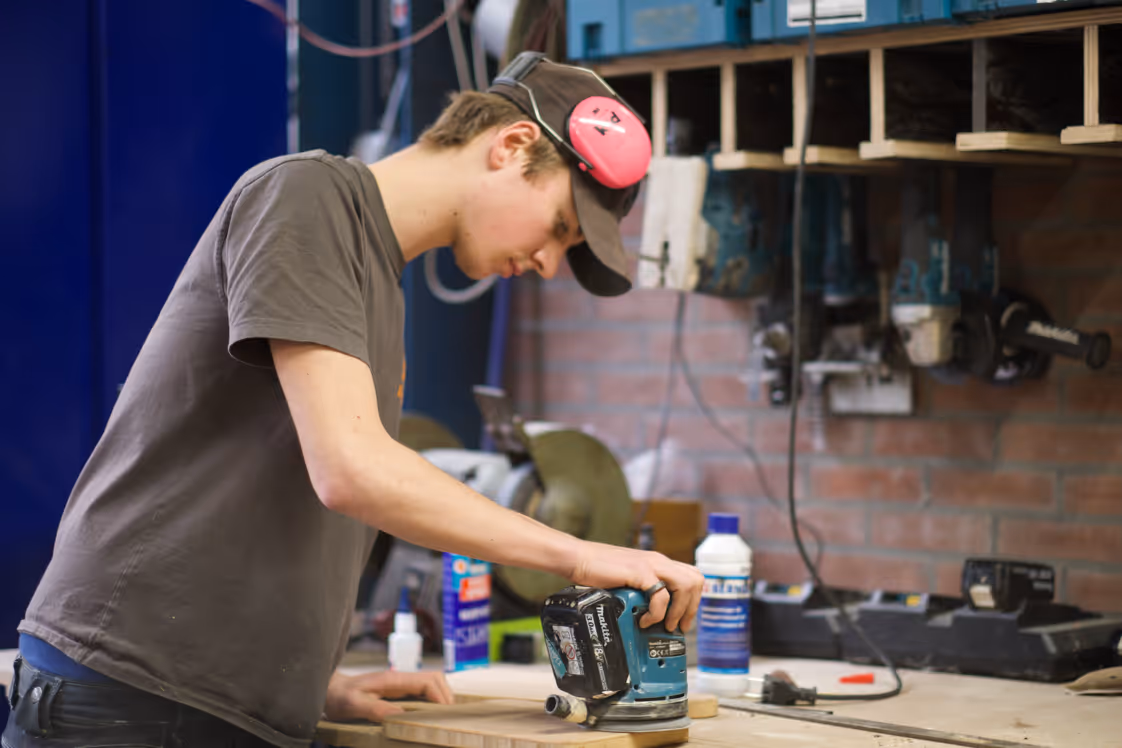 Production partner sanding wood
