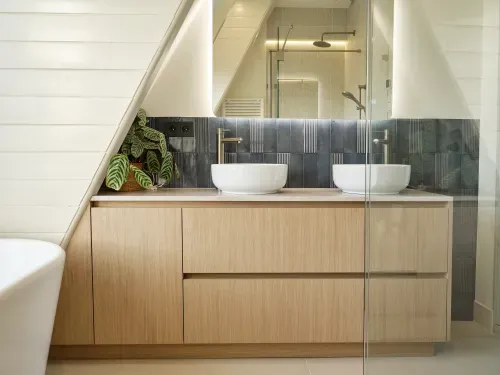 Modern bathroom vanity with two white vessel sinks, stainless steel faucets. Materials include Unilin MDF, Medite Smartply.