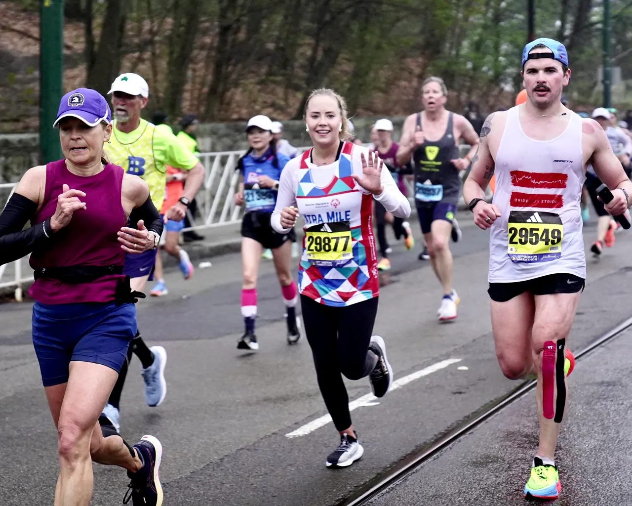 A man and a girl wearing their volunteer tshirts smiling
