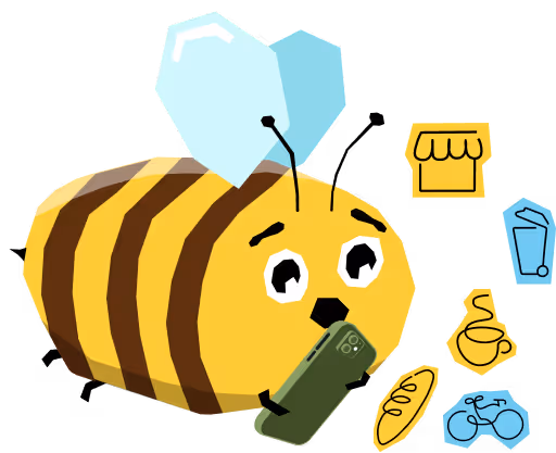 Rajzolt méh arckifejezéssel nézi a kezében tartott okostelefont, körülötte bevásárláshoz kapcsolódó ikonok, például bolt, ital, kenyér, kávé és bicikli.