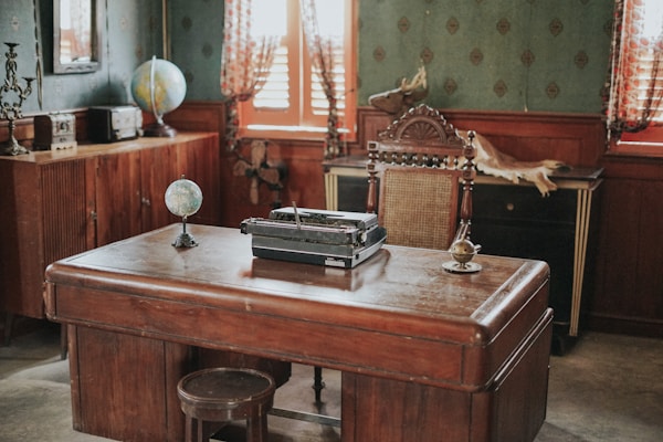 a desk with a typewriter on top of it