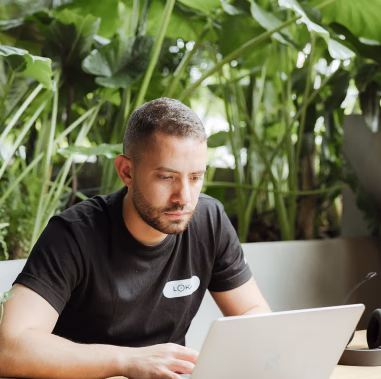 Loka colleague working on a laptop