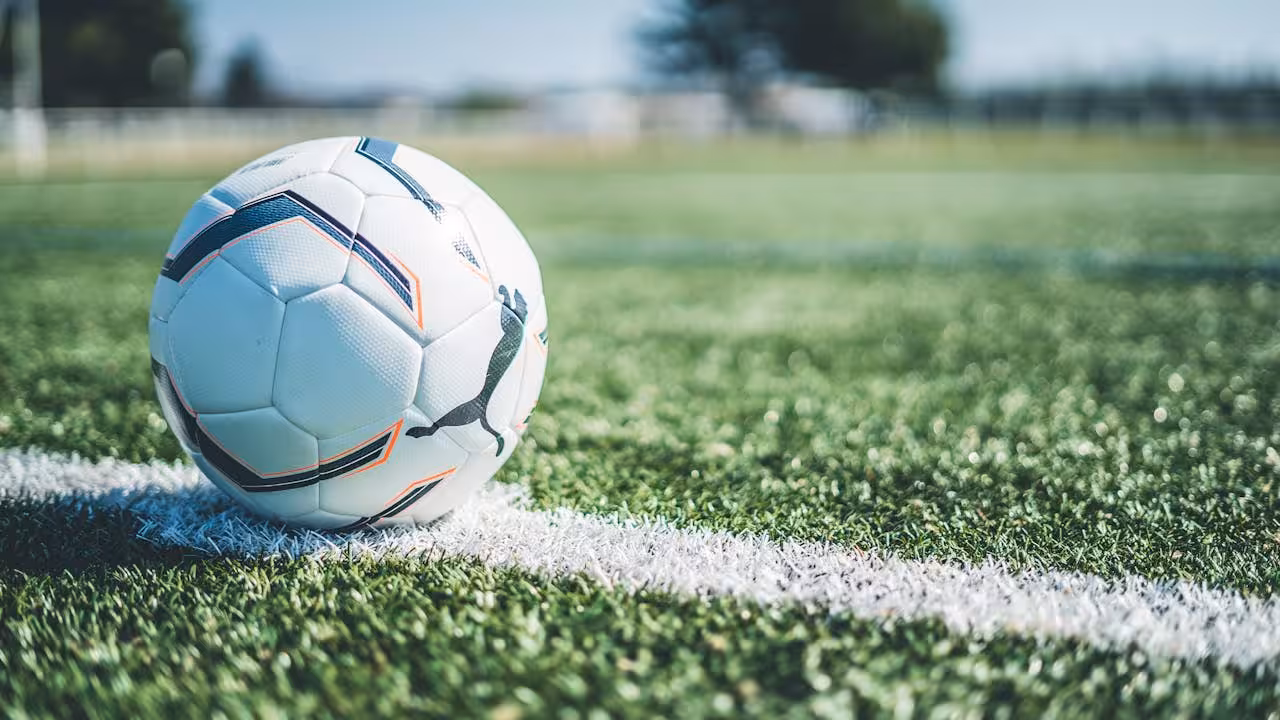Soccer ball on a pitch representing the streamlined booking process for Polish Soccer Skills camps.