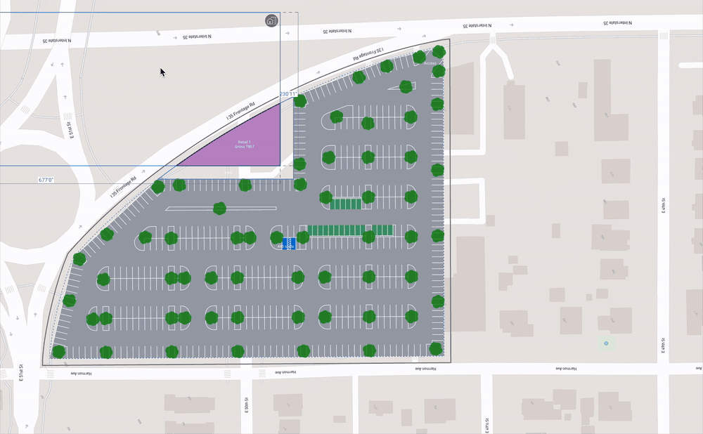 Retail buildings placed on a large corner site in TestFit while the surface parking field re-solves around them and the stall count updates.