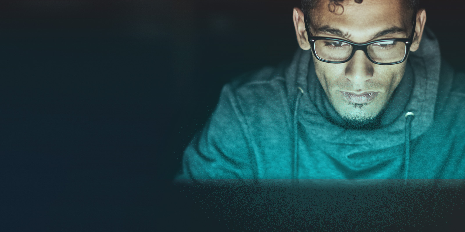 image of hands typing on a laptop with scientific data