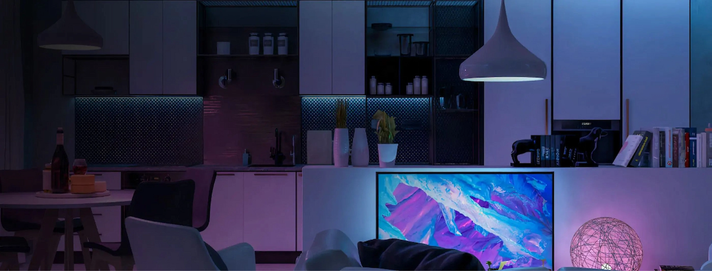 Modern kitchen and living room with smart LED lighting in purple and blue tones