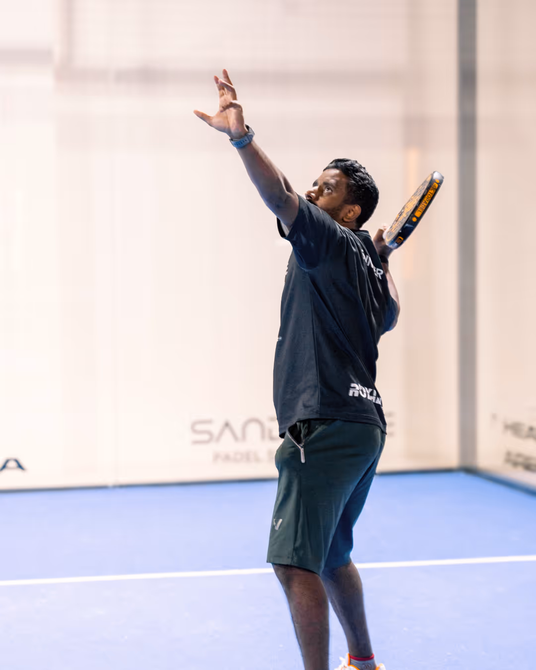 Padel Player standing ready to do a bandeja shot