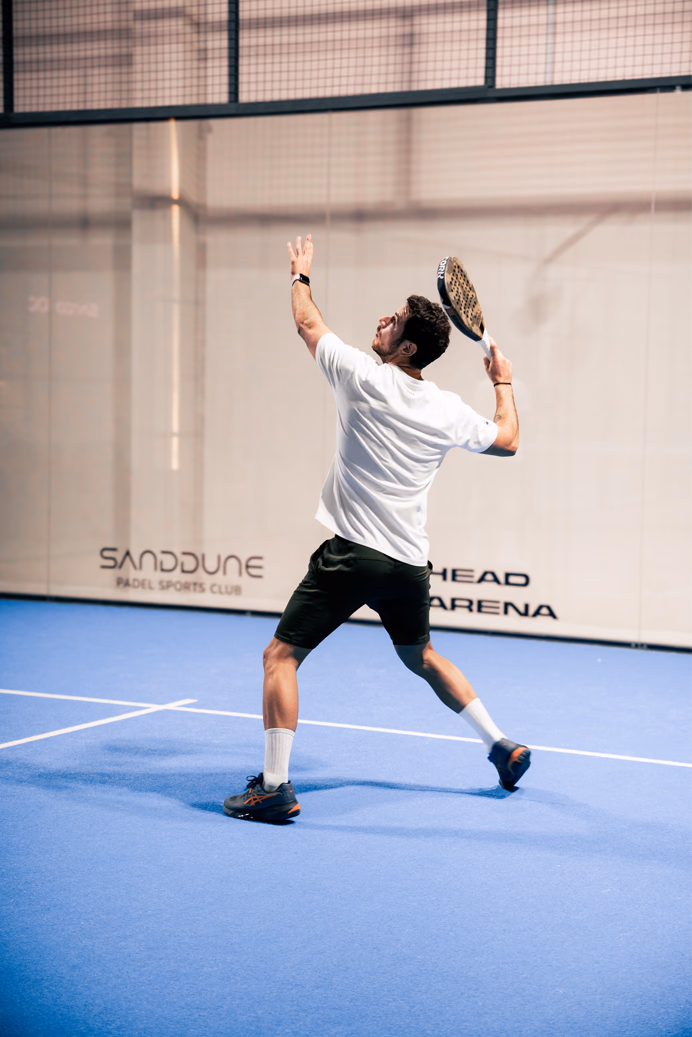 A player hitting a volley during the Sanddune Social Tournament.