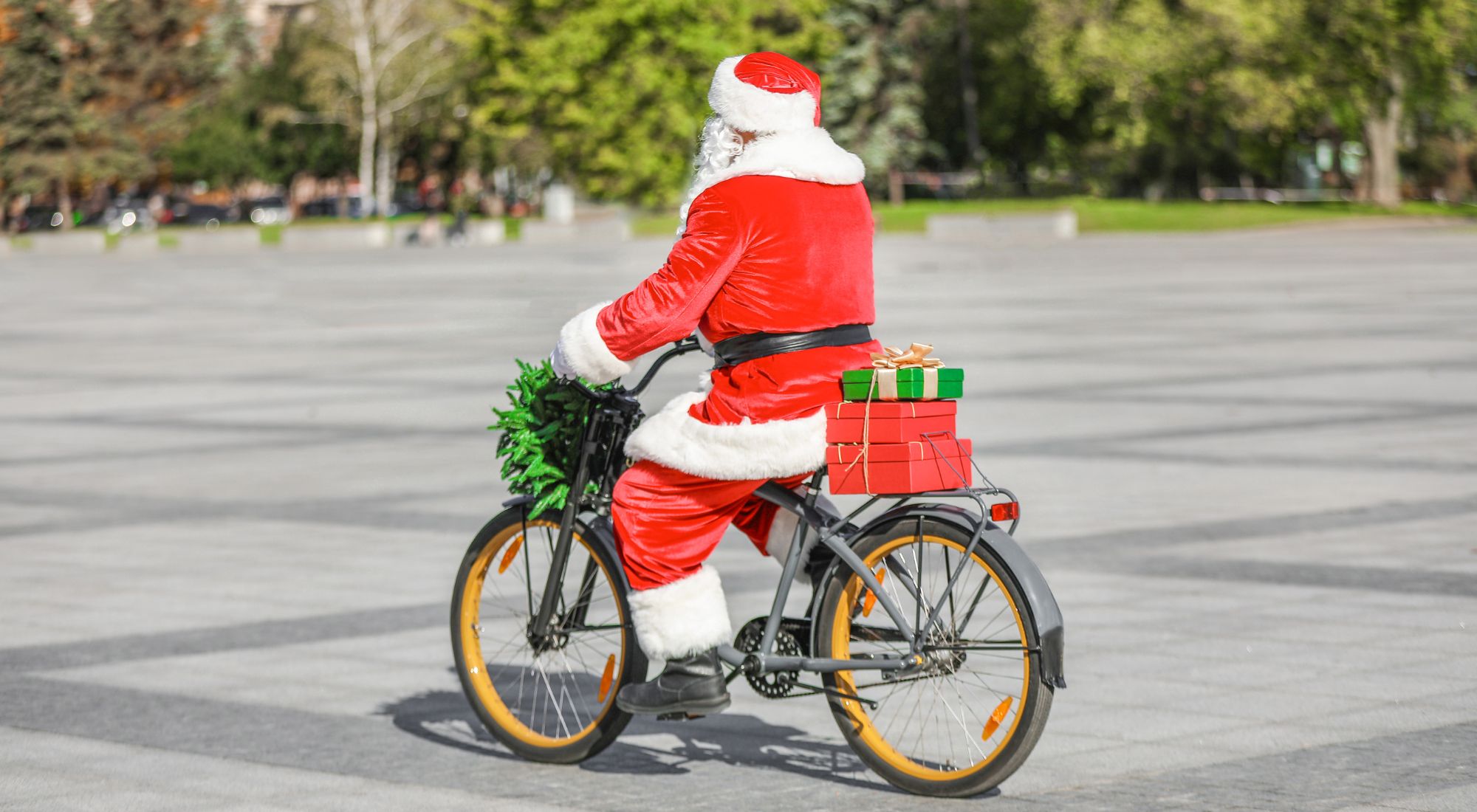 Santa Claus on a bike with presents on the pannier rack