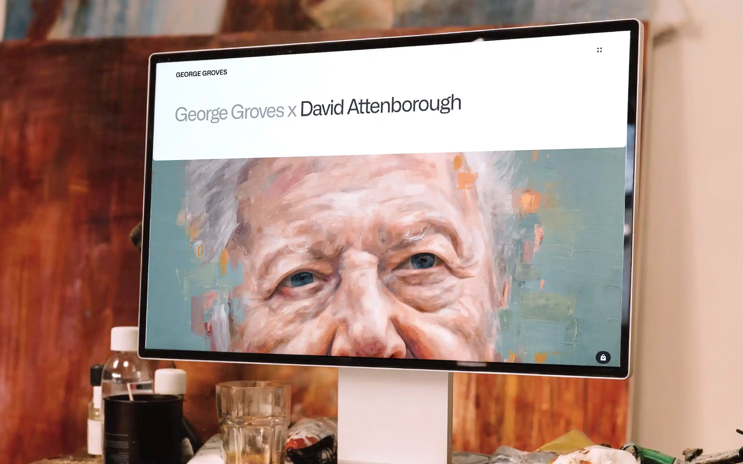 Mockup of the George Groves website on a Mac Studio Display, in the artist studio.
