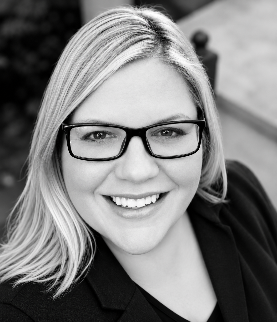 Amy Cox, Deep South Senior Vice President, a woman with long blonde hair and black glasses smiles at the camera