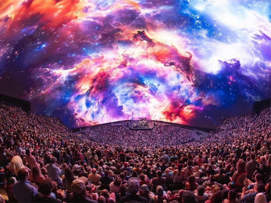 A large crowd of people in a stadiumAI-generated content may be incorrect.