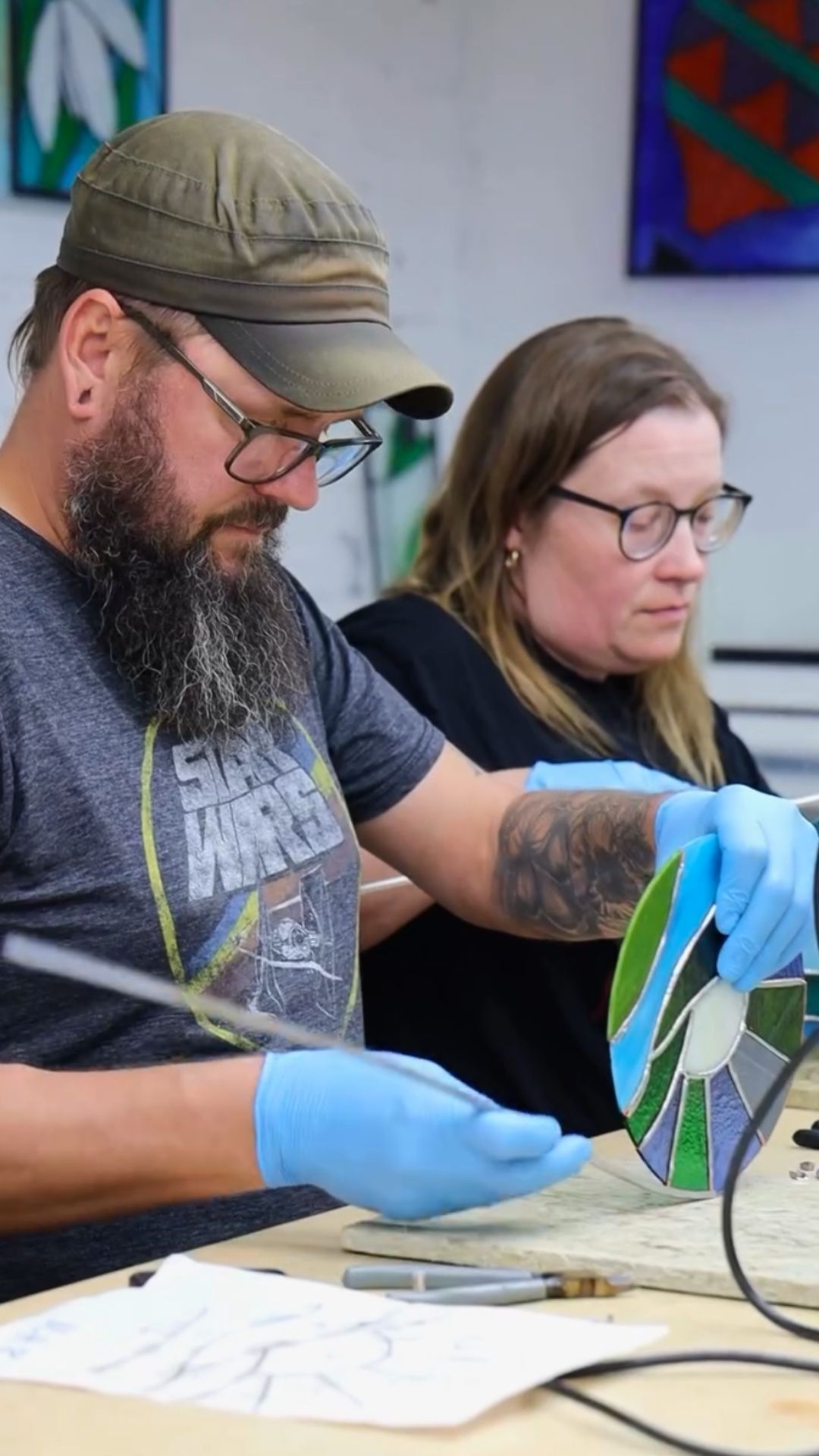 Students in Melt Glass' Stained Glass 101 class wrapping their projects