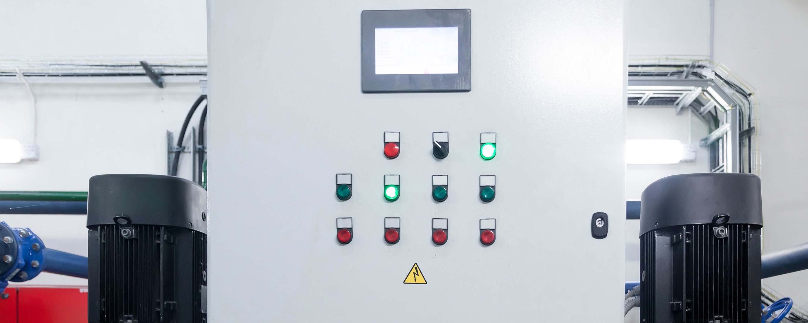 sewage ejector pump control panel with green light during routine maintenance inspection