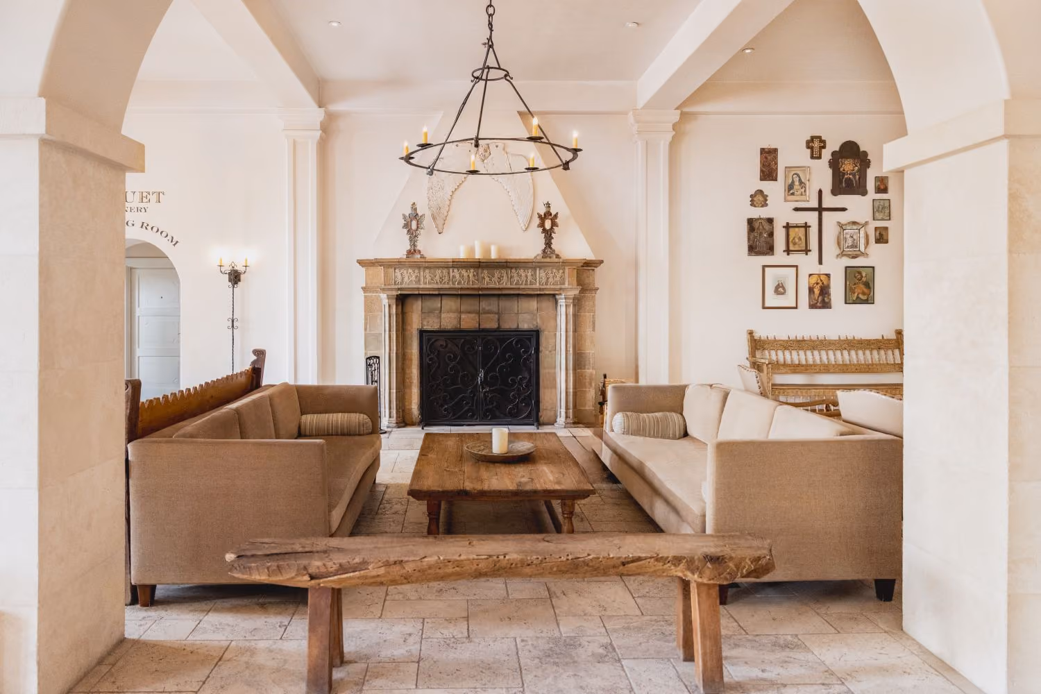 Fireplace with couches and wooden furniture in hotel lobby