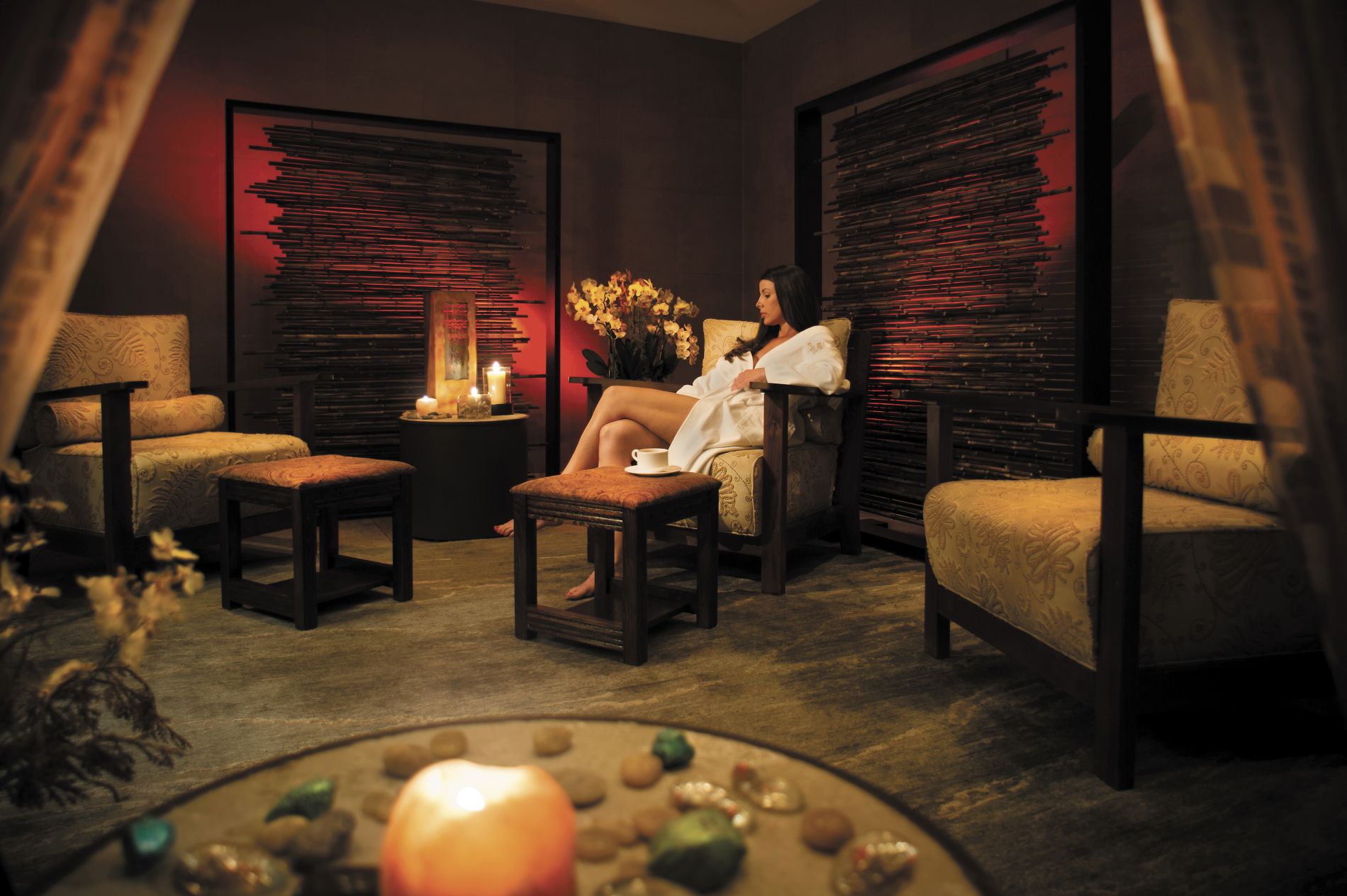 Spa treatment room with Southwestern patterned blankets on treatment beds