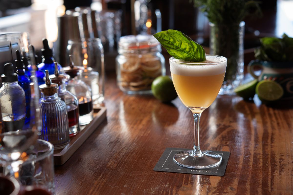 Secret Garden Cocktail with a spring of basil sprig of