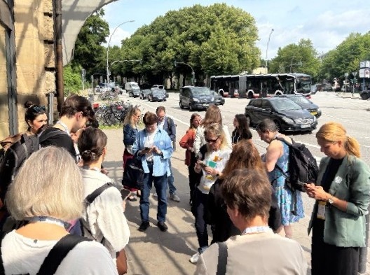 Photo of walkshop participants answering survey questions on their phones.