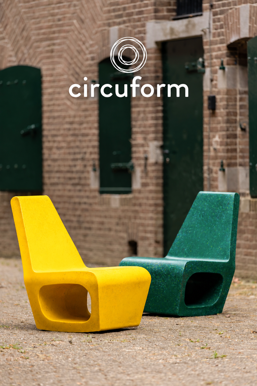 An image of designer Ineke Hans holding the chair as if it where to be recycled.