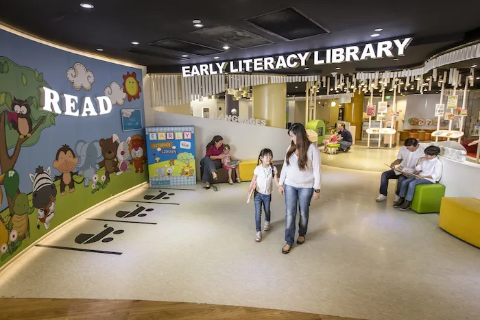 A mother and daughter walking away from an early literacy library.