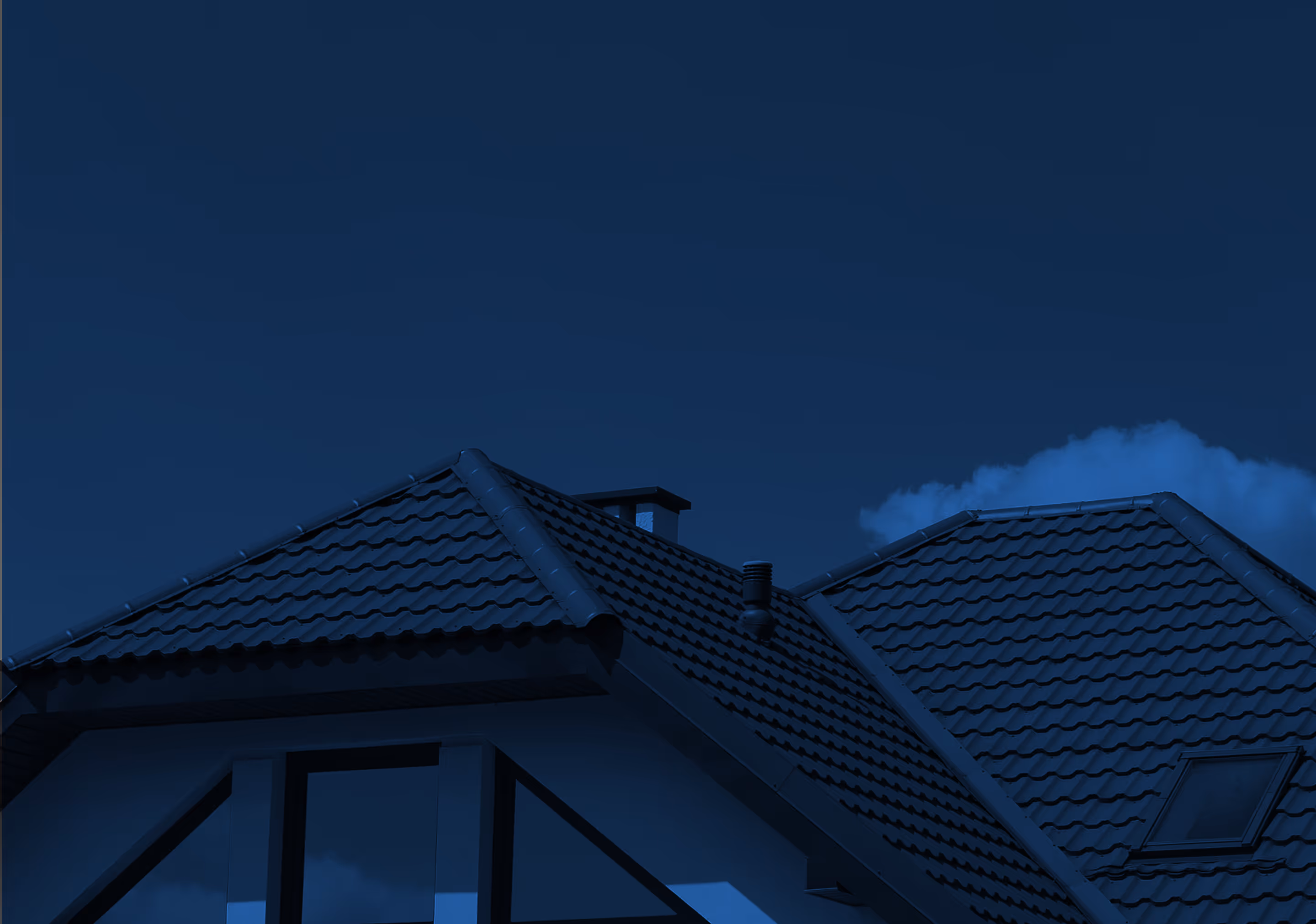 Dark-tiled house roof with a chimney and skylight under a deep blue night sky.