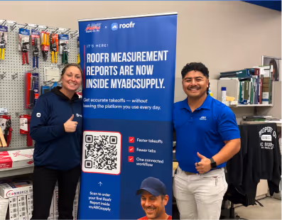 Two people giving thumbs up next to a banner for roof measurement reports by myabcsupply with QR code.