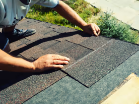 An image of a roofer shingling a roof after winning the job with a strong, professional quote. 