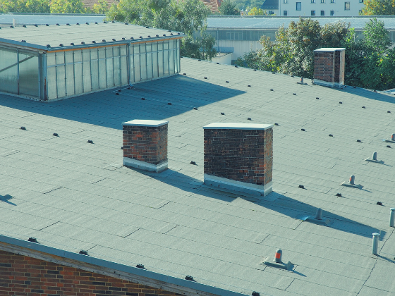 A flat top commercial building ready for a reroof or maintenance.
