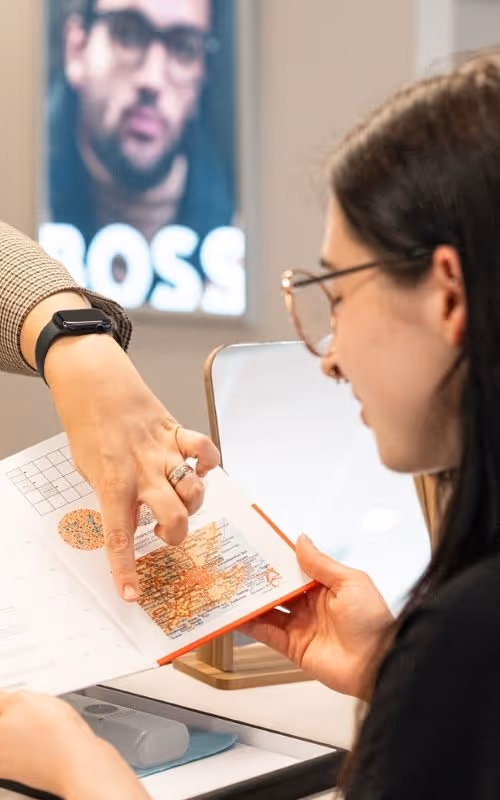 Optometrist at Merivale Vision Care performing a children's vision exam.