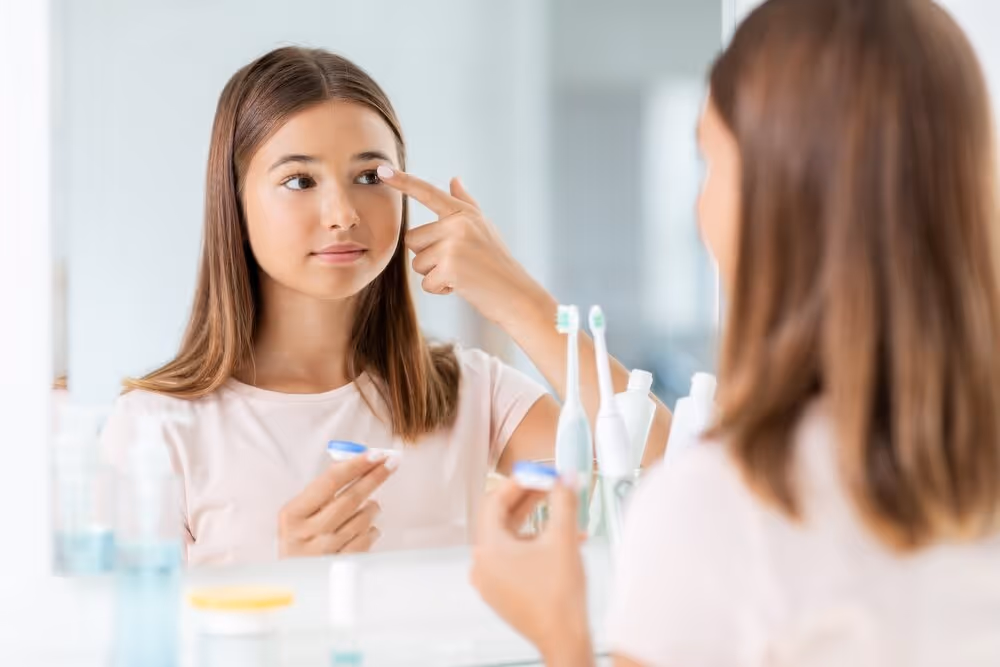 Little Girl Putting in Contact Lenses