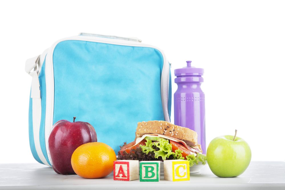 Backpack Drive in support of the Boys and Girls Club of Ottawa (BGC).  Closeup of a packed school lunch with alphabet blocks.