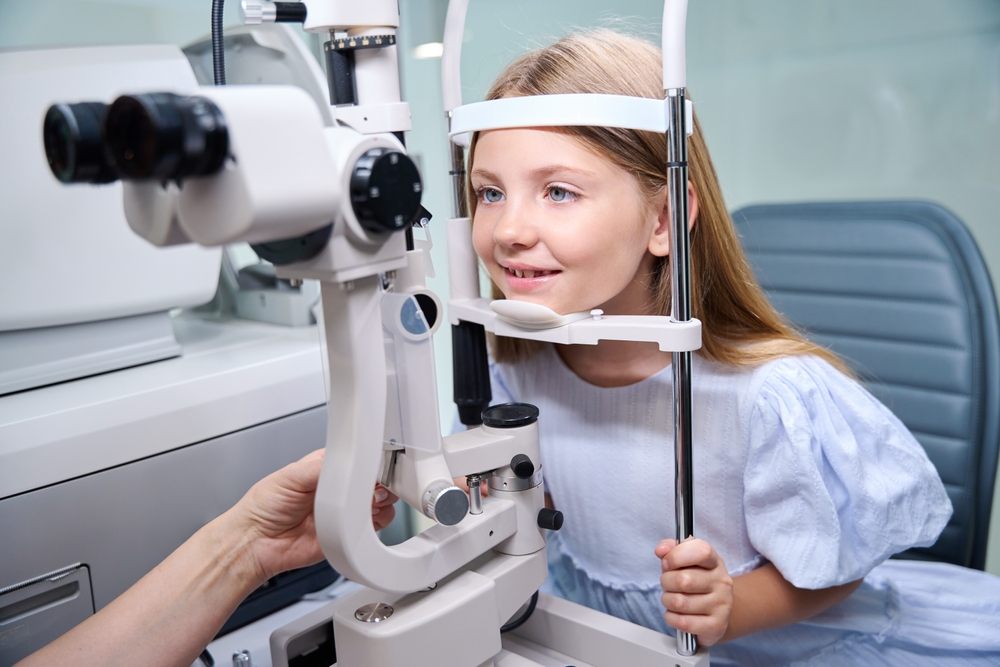 Healthy Vision in a Digital Era. Pediatric Vision Support. Child undergoing ophthalmic examination at eye clinic done by optometrist.