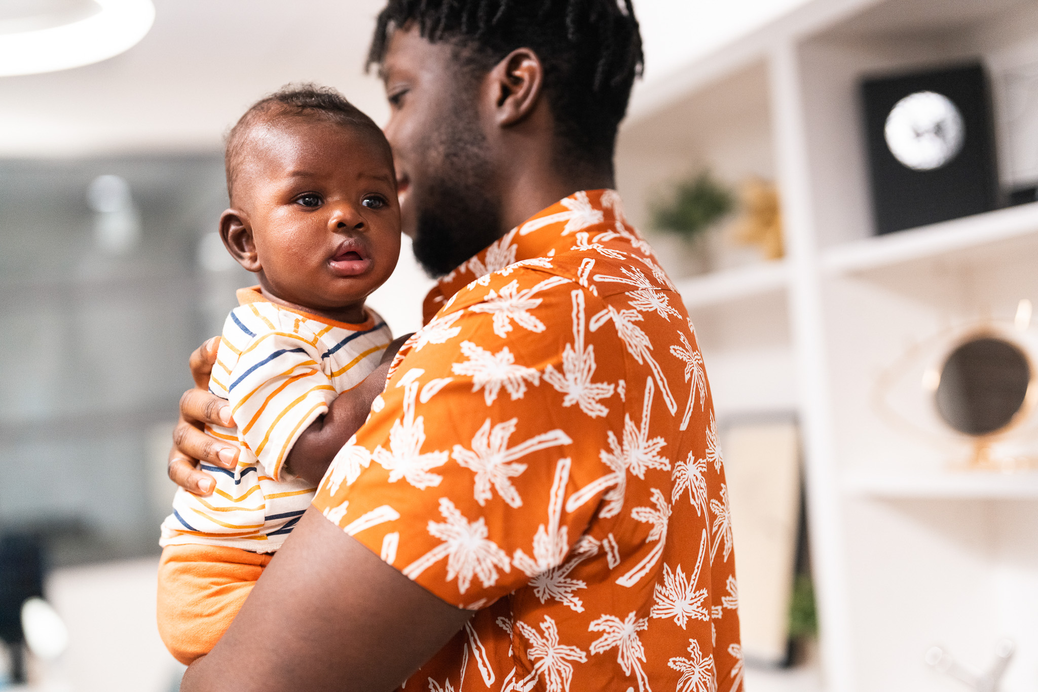 Young baby held by father; waiting for appointment at Merivale Vision Care
