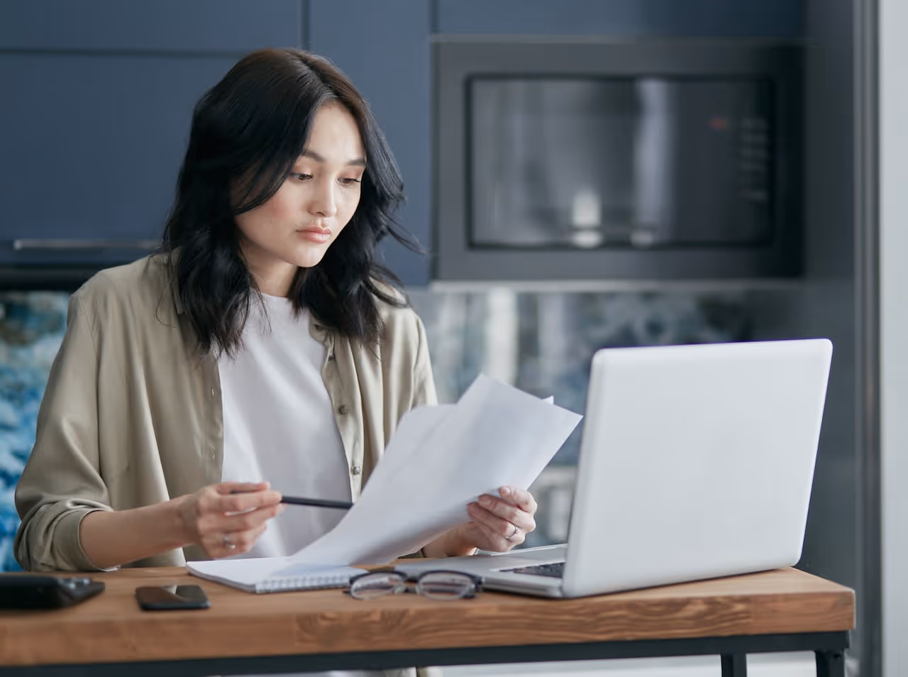 financial advisor reviewing tax payment schedule on laptop