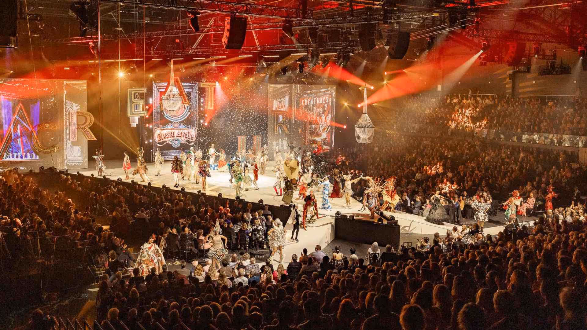 A photo from the 2024 World of WearableArt Show showing finalist garments in the Crazy Curiosities of the Creature Carnival Section