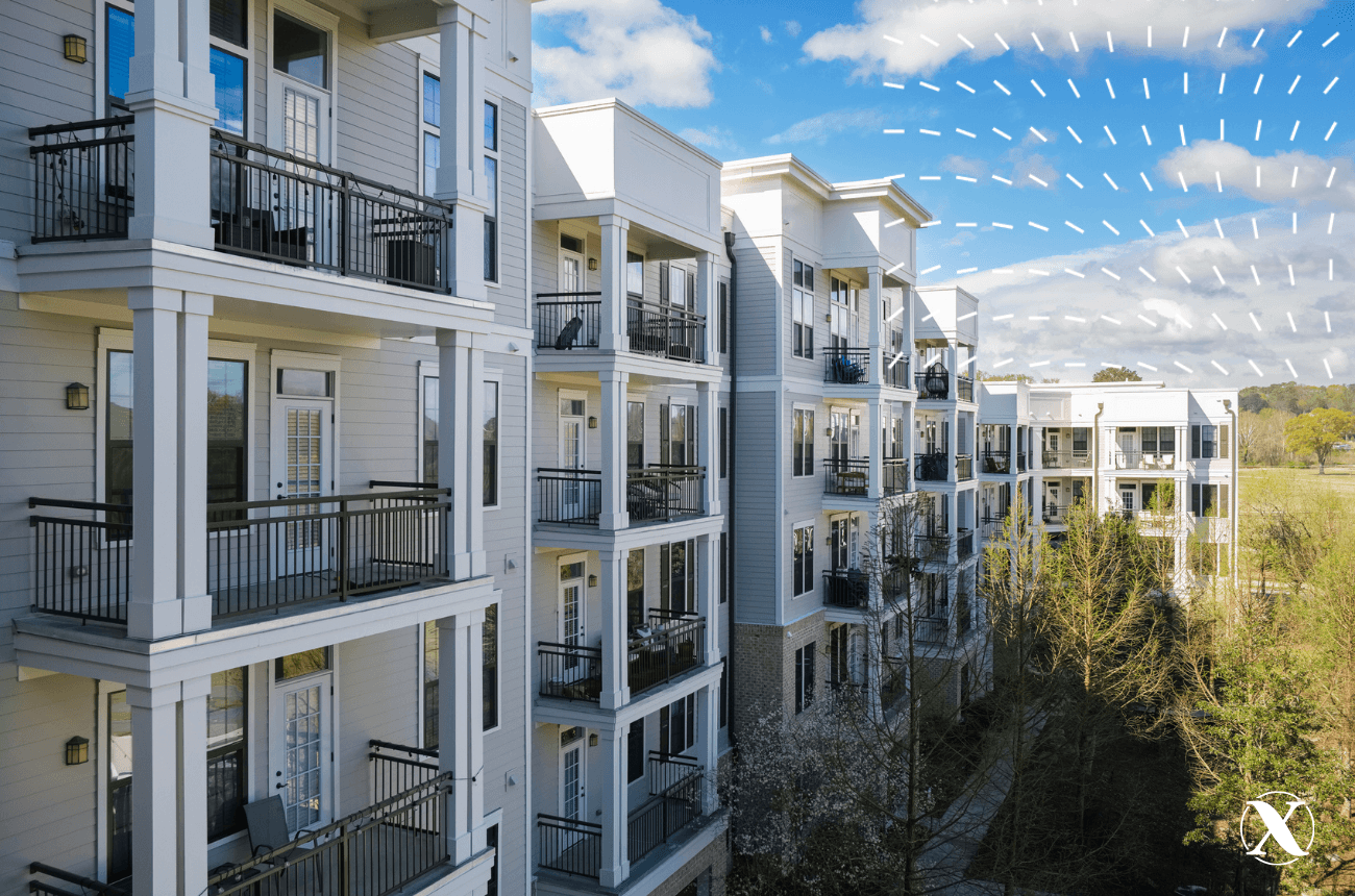 Apartment building with cloudy sky in the background.