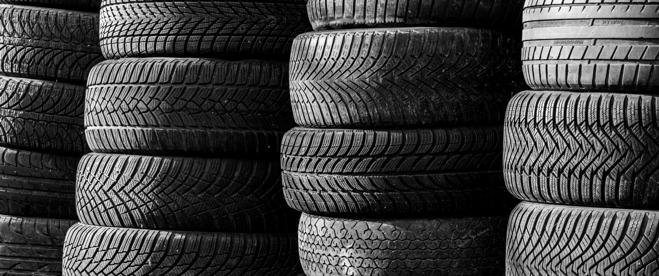 Image of a wall of stacked used tires