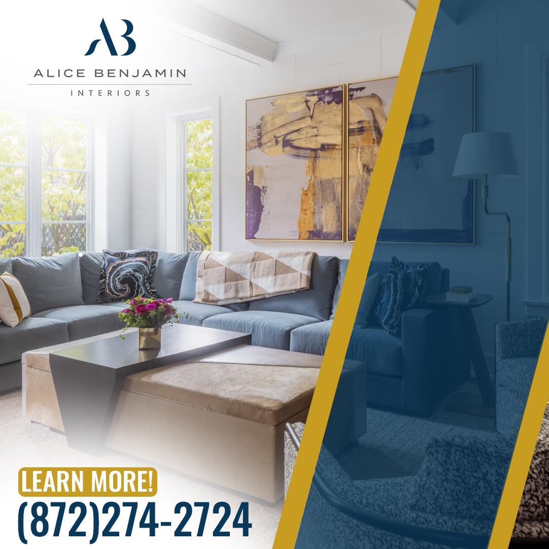 Modern living room featuring a blue sectional sofa, abstract wall art, large windows, and elegant furnishings designed by Alice Benjamin Interiors.