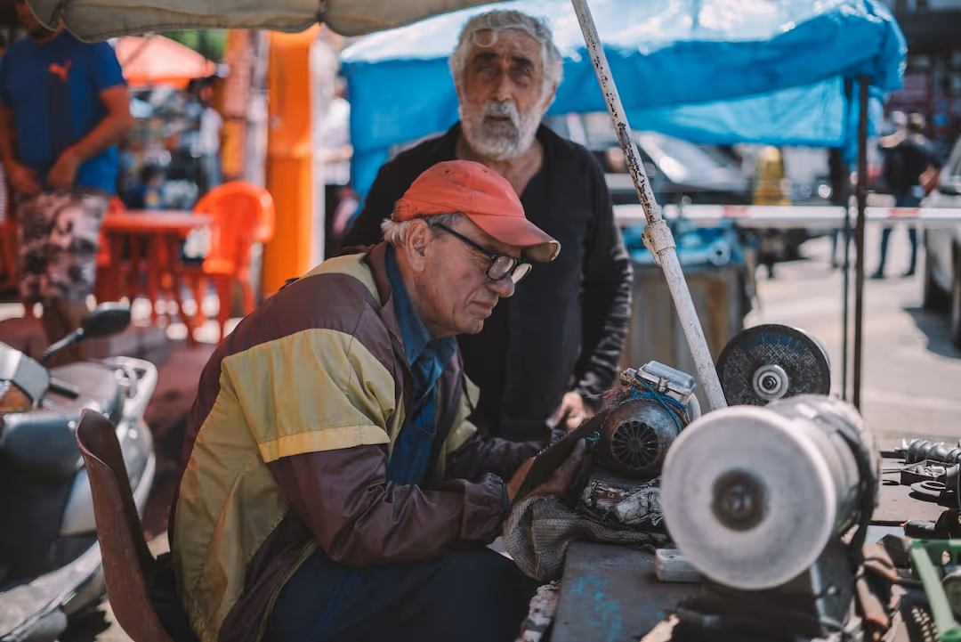 image of men working with tools