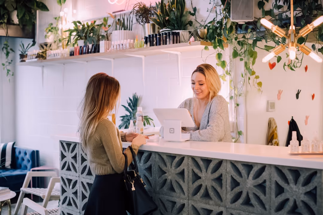 woman at checkout register at store
