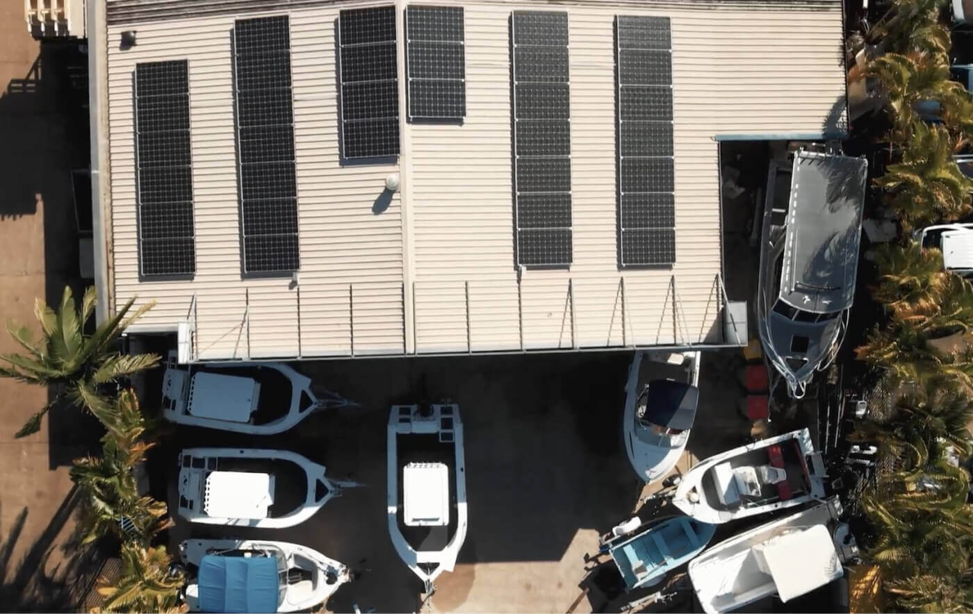 Aerial view of a commercial solar installation on the Laguna Boating Centre roof