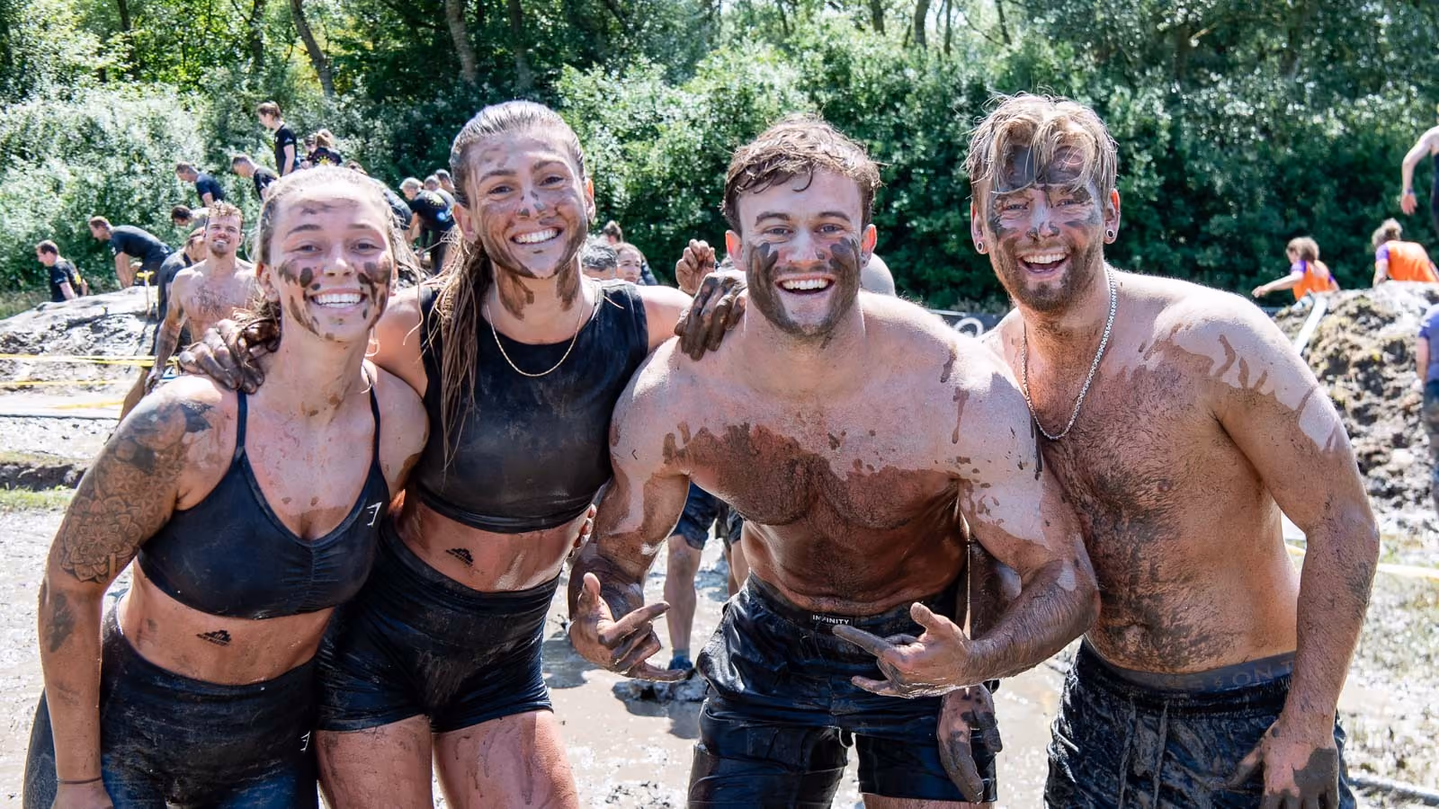 Pictures of people doing a Mud Run of Mud Masters