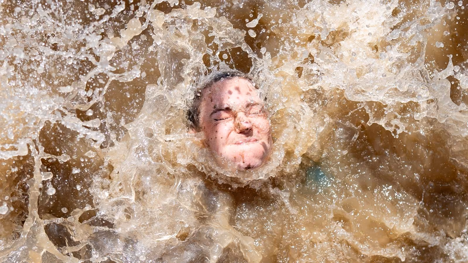 Pictures of people doing a Mud Run of Mud Masters