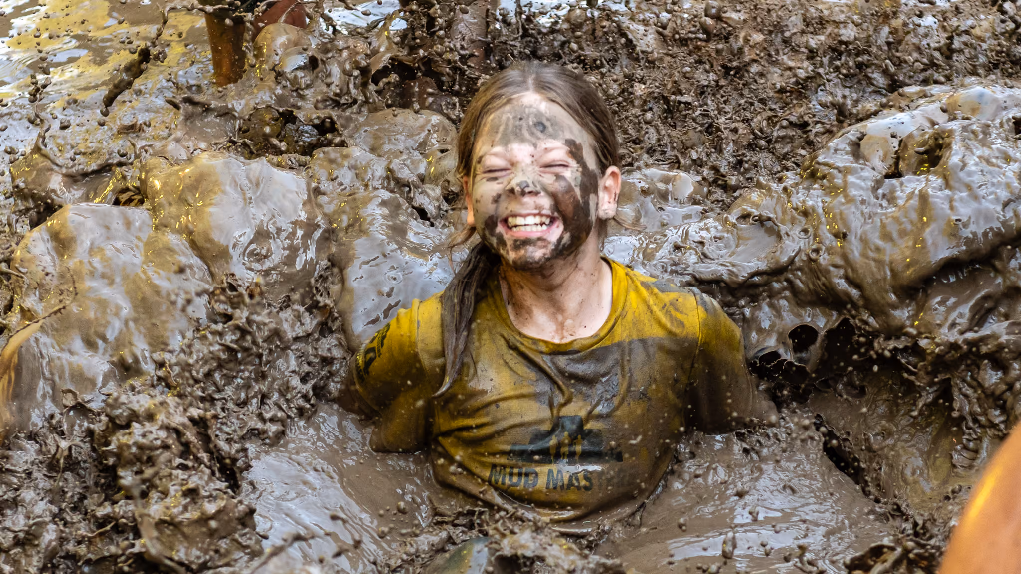 Pictures of people doing a Mud Run of Mud Masters