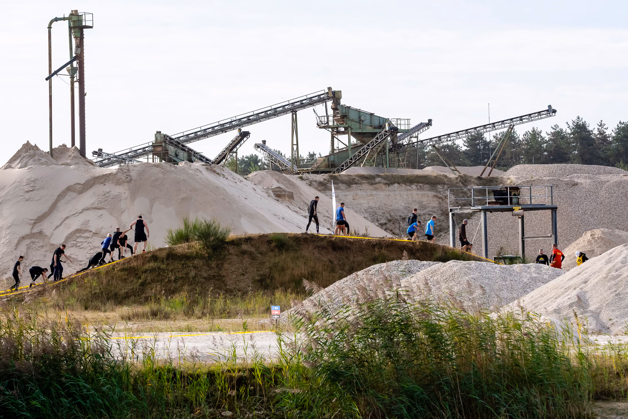 Pictures of people doing a Mud Run of Mud Masters