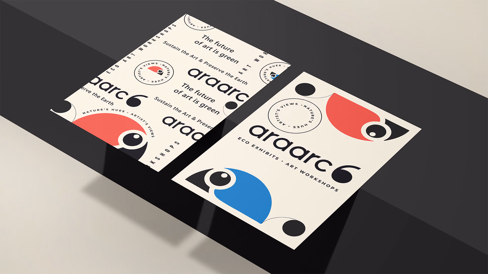 AraArc 6 printed cards featuring the exhibition logo and macaw illustration.
